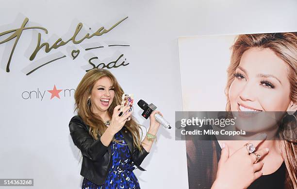 Singer/actress Thalia takes a picture during the launch of her new clothing line 'Sodi' at Macy's Herald Square on March 8, 2016 in New York City.
