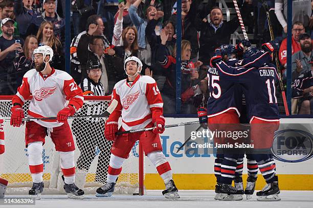 David Clarkson of the Columbus Blue Jackets celebrates his second period goal with teammates William Karlsson and Matt Calvert of the Columbus Blue...