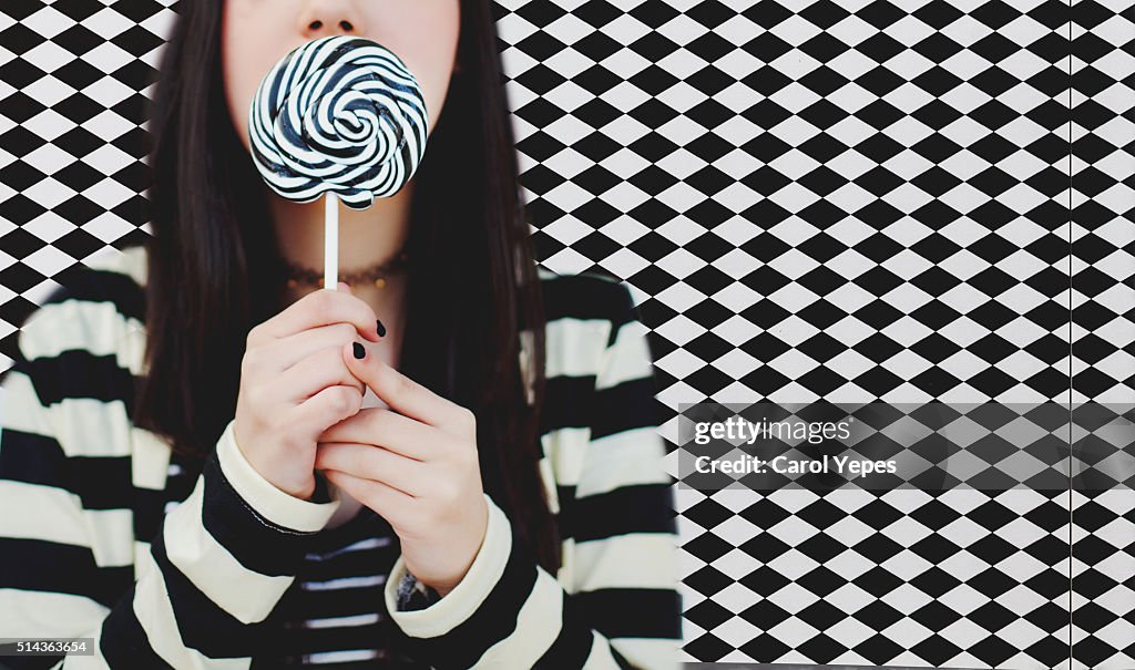 Woman with swirl lollipop.Pattern background