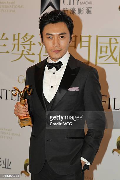 Actor Qin Hao attends the Gold Aries Award Of Macau International Film Festival on March 8, 2016 in Macau, China.