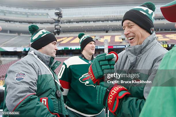 Minneapolis, MN Head coach John Torchetti, goalie Devan Dubnyk, and assistant coach Rick Wilson of the Minnesota Wild talk during the Coors Light NHL...