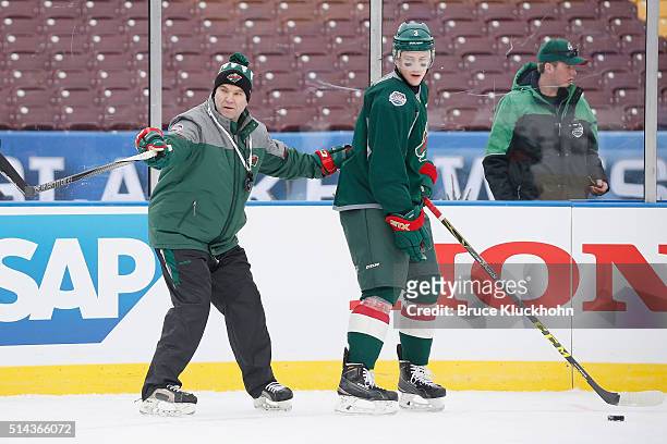 Minneapolis, MN Minnesota Wild head coach John Torchetti instructs Charlie Coyle during the Coors Light NHL Stadium Series Practice Day on February...