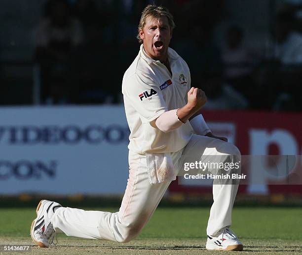 Shane Warne of Australia celebrates after bowling VVS Laxman of India during day two of the First Test between India and Australia played at the...