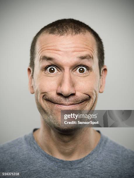 portrait of an american real man. - pulling funny faces stock pictures, royalty-free photos & images
