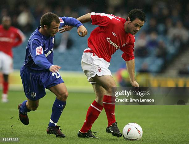 Jody Morris of Millwall battles with Andy Reid of Nottingham Forest during the Coca-Cola Championship League match between Millwall and Nottingham...