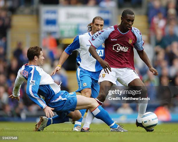 Brett Emerton of Blackburn Rovers tackles Carlton Cole of Aston Villa during the Barclays Premiership match between Blackburn Rovers and Aston Villa...