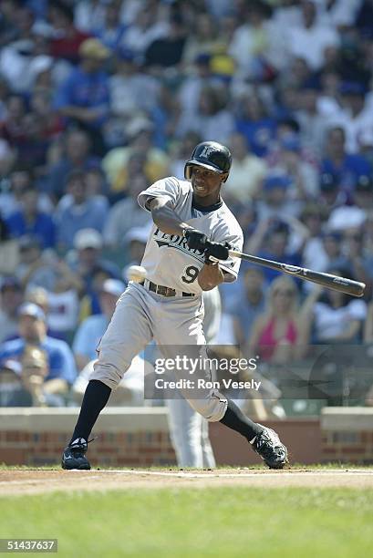 September 12: Outfielder Juan Pierre of the Florida Marlins takes a swing during the game against the Chicago Cubs at Wrigley Field on September 12,...