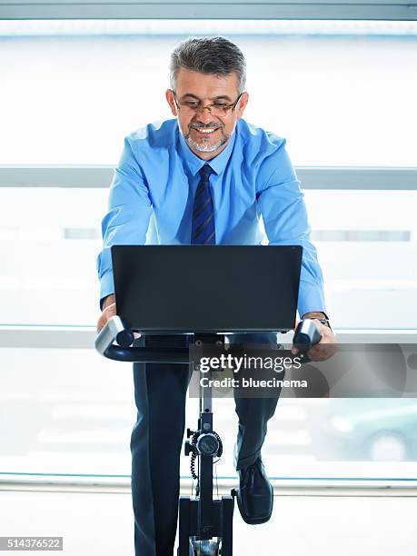 businessman exercising in fitness - peloton bildbanksfoton och bilder