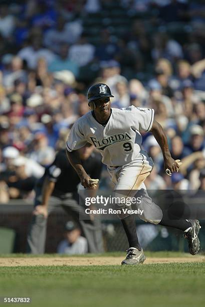 September 12: Outfielder Juan Pierre of the Florida Marlins runs the bases during the game against the Chicago Cubs at Wrigley Field on September 12,...