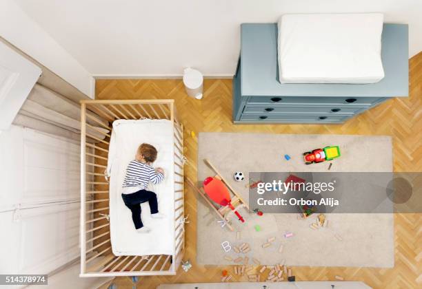 toddler sleeping in his room - nursery bedroom stockfoto's en -beelden