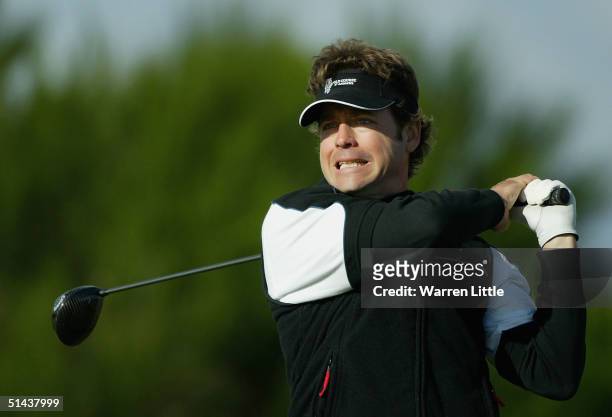 Actor Greg Kinnear tees off on the fifth hole during the first round of the Dunhill Links pictured at Kingsbarns Golf Club on October 7, 2004 in St...