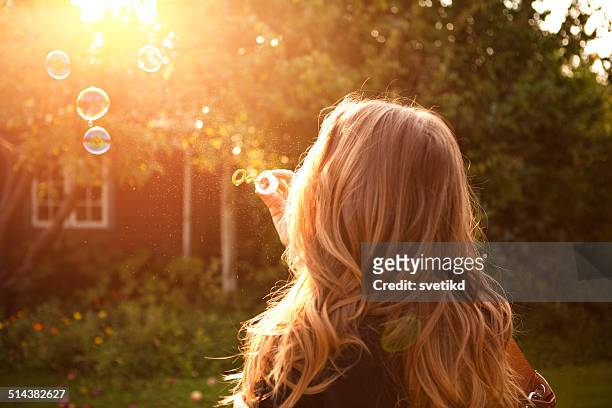 woman enjoying the sun. - blond hair young woman sunshine stock pictures, royalty-free photos & images