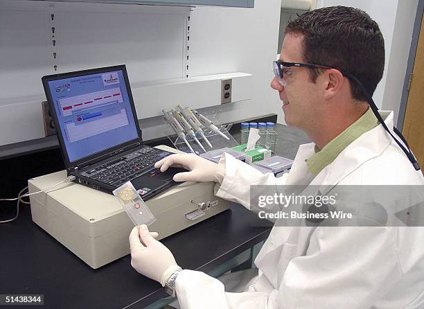 Scientist at the Naval Research Laboratory in Washington, D.C. Uses the Bead ARray Counter to examine the DNA results of a biological sample.
