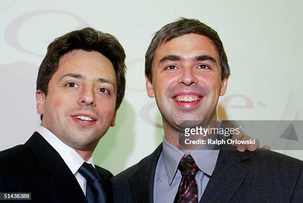 Google founders Sergey Brin and Larry Page smile prior to a news conference during the opening of the Frankfurt bookfair on October 7, 2004 in...