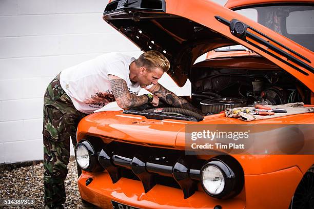 custom car mechanic working on a hotrod truck. - hot rod car stock pictures, royalty-free photos & images