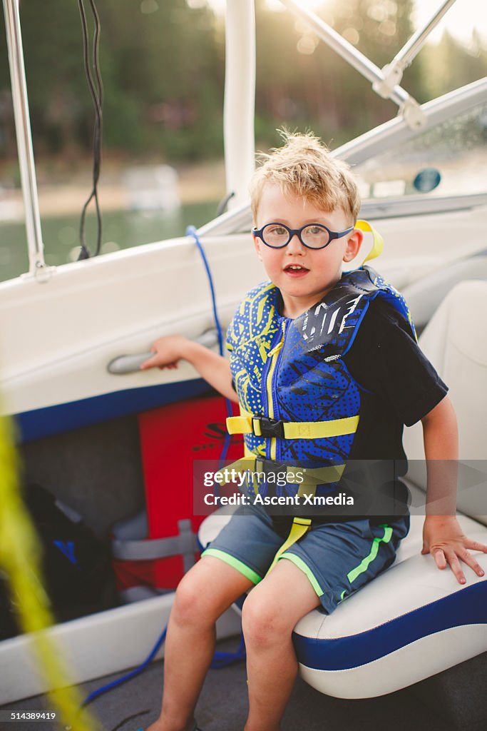 Portrait of young boy waiting for boat ride