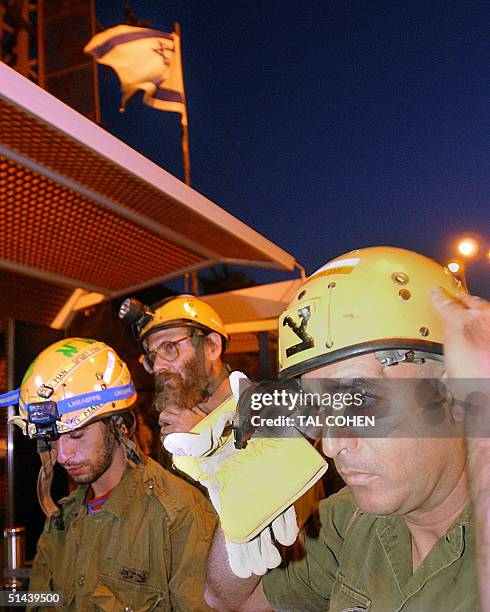 An Israeli army rescue team makes its way 08 October 2004 towards the Egyptian side of the border from the southern Israeli town of Eilat, following...