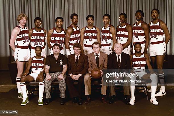 The Eastern Conference All-Stars pose for a team photo, front row : Nate Archibald, Trainer John Lally, Assistant Coach Chuck Daly, Head Coach Billy...