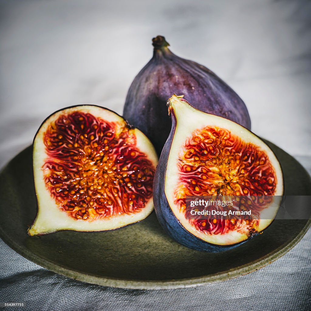 Fresh figs laying on a plate