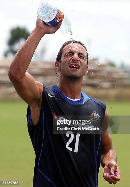 Ahmad Elrich cools off during Australian Socceroos training held at A and E Oval, October 8, 2004 in Honiara, Solomon Islands.