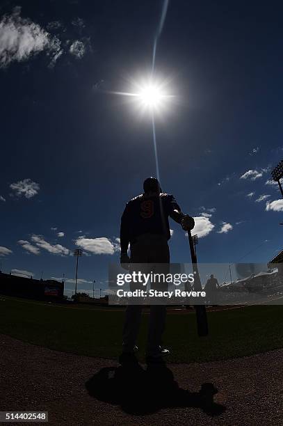 Roger Bernadina of the New York Mets participates in warmups prior to a spring training game against the Atlanta Braves at Champion Stadium on March...