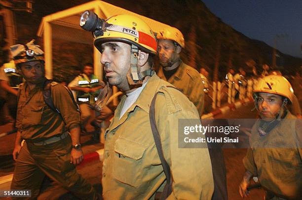 An Israeli army rescue team makes its way towards the Egyptian side of the border from the southern Israeli town of Eilat, on October 8, 2004 in...