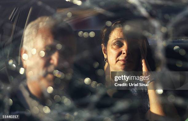 Distressed Israelis are seen throught their broken car windscreen as they return home from Egyypt to the southern Israeli town of Eilat, on October...