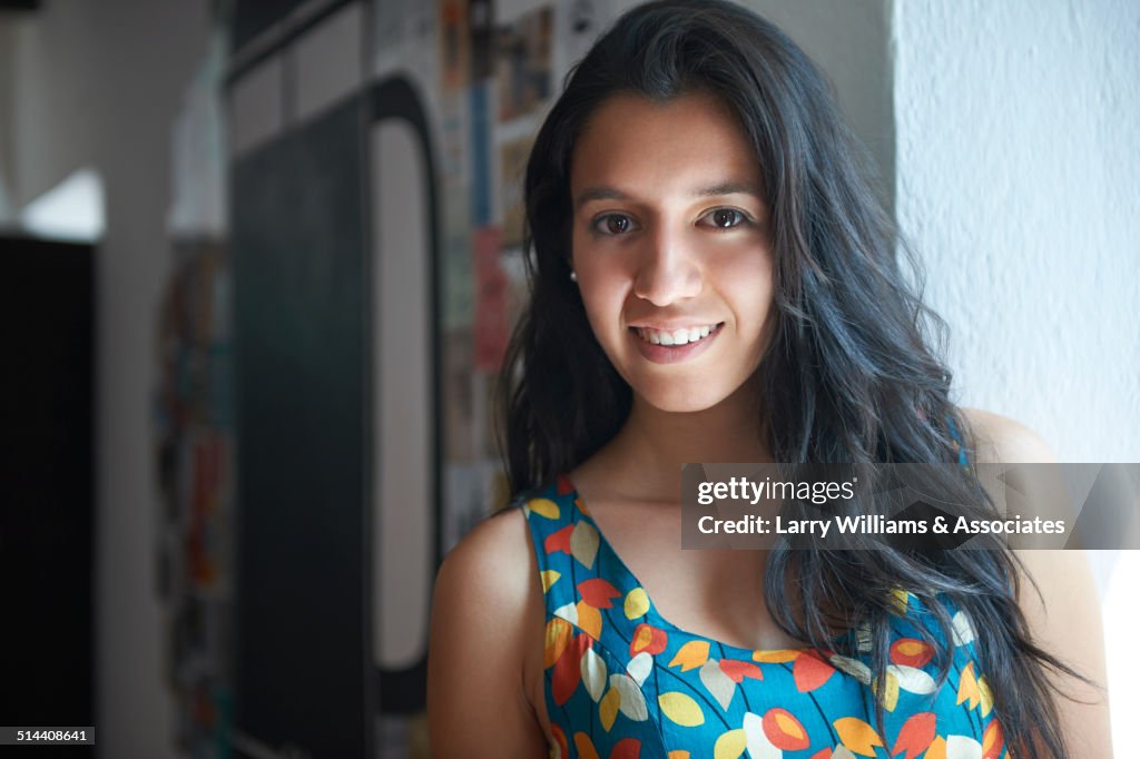 Hispanic woman smiling indoors