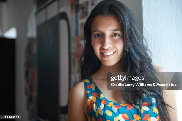 Hispanic woman smiling indoors