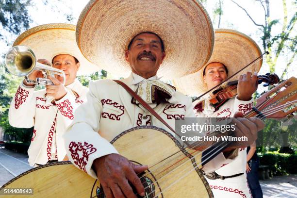 musicians playing in mariachi band, san miguel de allende, guanajuato, mexico - characteristic of mexico stock-fotos und bilder