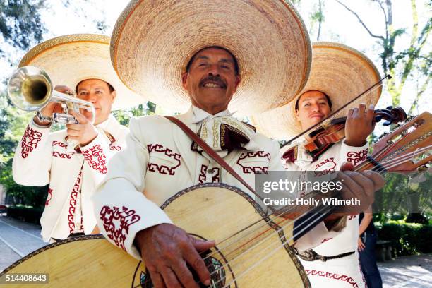 musicians playing in mariachi band, san miguel de allende, guanajuato, mexico - cultural tradition stock pictures, royalty-free photos & images