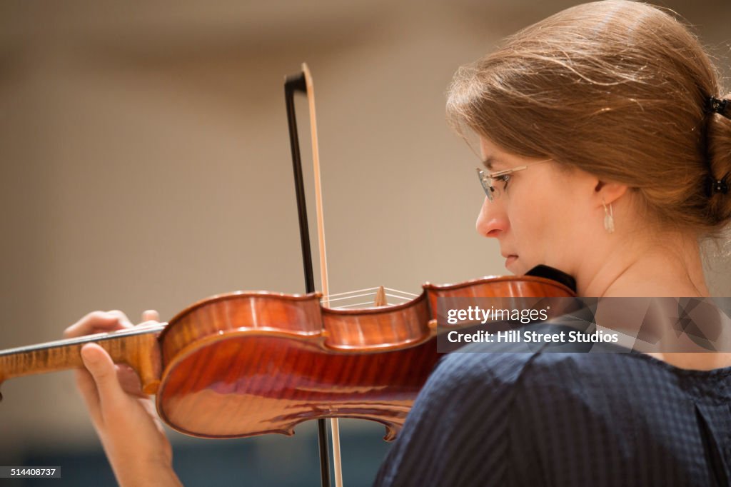 Close up of student playing violin