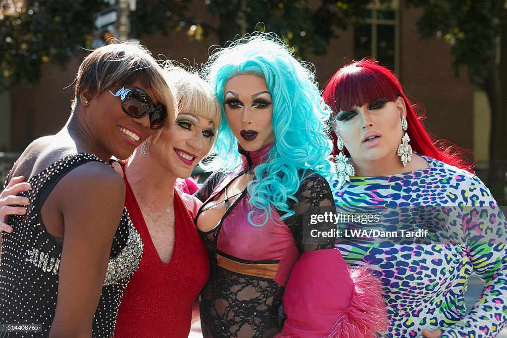 Drag queens posing on city street