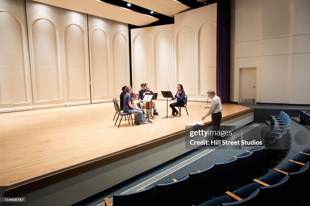 Students playing in college string quartet