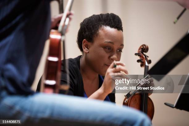 student playing violin in string quartet - practice stock pictures, royalty-free photos & images