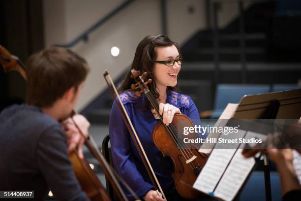 student playing in college string quartet - classical music stock pictures, royalty-free photos & images