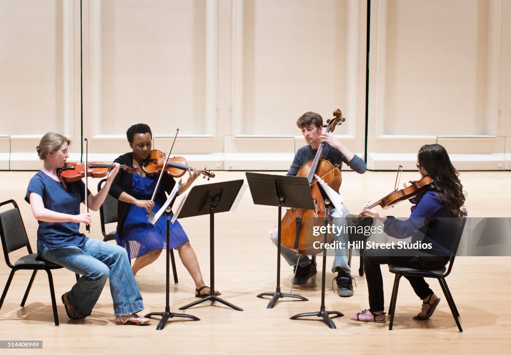 Students playing in college string quartet