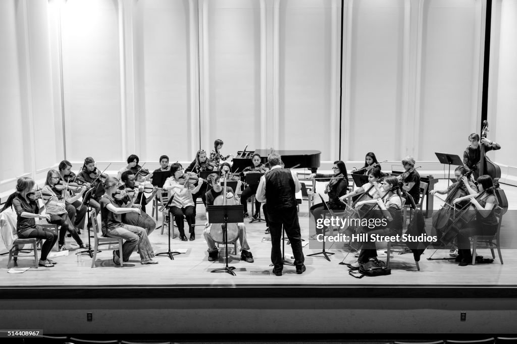 Students playing in college orchestra