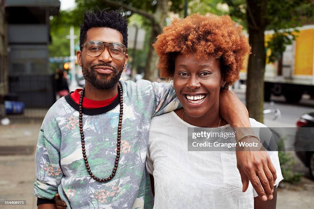 Couple hugging on city street