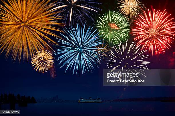 fireworks exploding over cruise ship in bay, seattle, washington, united states - firework display stock pictures, royalty-free photos & images