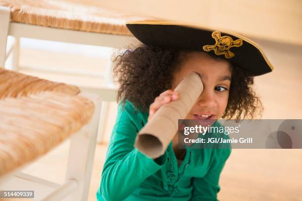african american girl playing with cardboard tube - pirate hat stock pictures, royalty-free photos & images