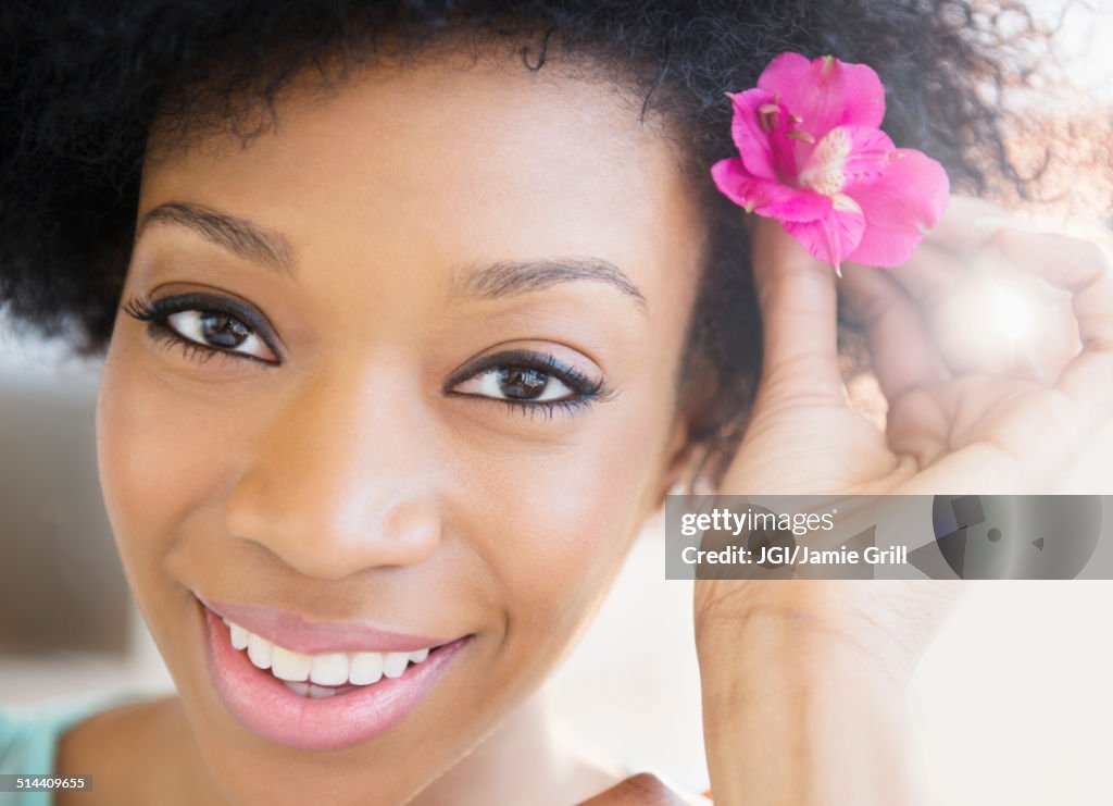 African American woman wearing flower in hair