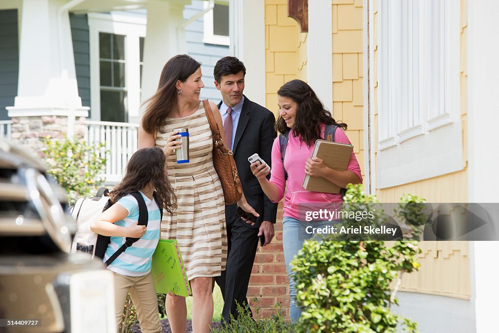 Caucasian family walking to car