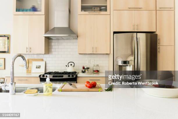 food and cooking implements on kitchen counter - kitchen counter stock pictures, royalty-free photos & images