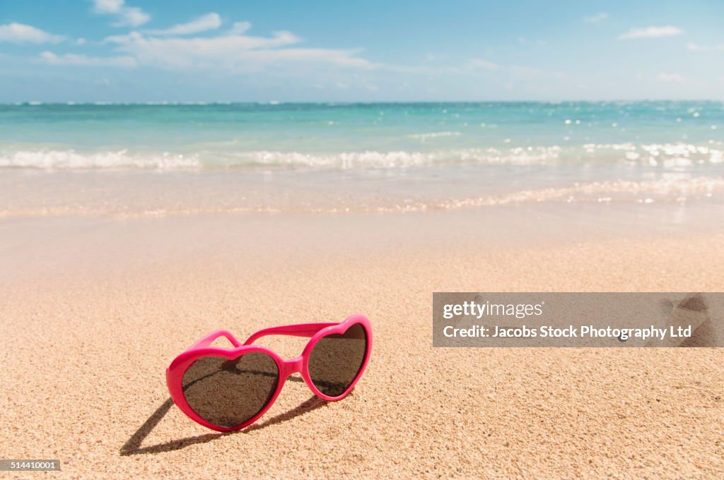 Close up of sunglasses on tropical beach