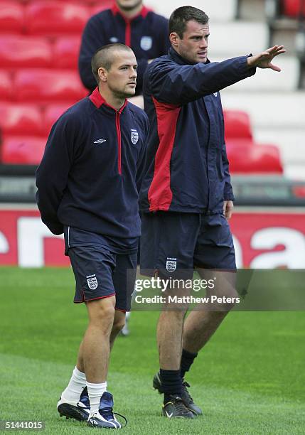 Michael Owen and Jamie Carragher of England talk during an England training session ahead of the England v Wales World Cup qualifier at Old Trafford...