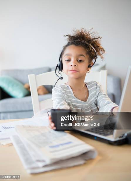 african american girl using headset, cell phone and laptop - business girl stock pictures, royalty-free photos & images