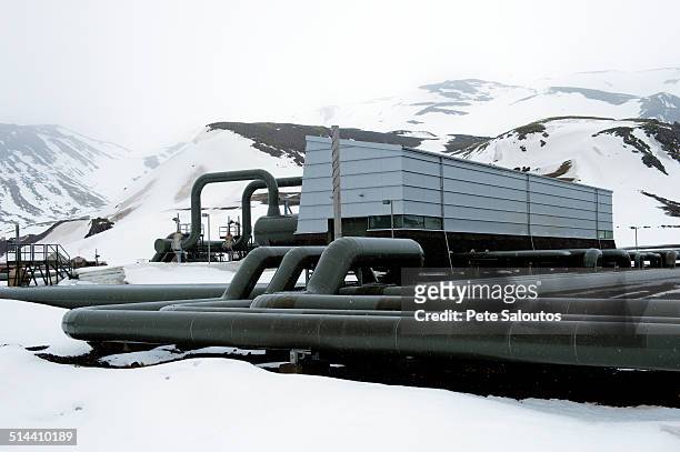 power plant in arctic landscape - frozen pipes foto e immagini stock