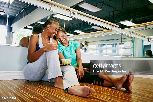 women laughing in yoga studio - atelier food stock-fotos und bilder