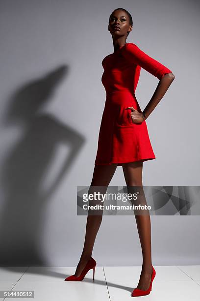 fashion  beautiful african ethnicity  young women   wearing a red dress - red dress model stock pictures, royalty-free photos & images